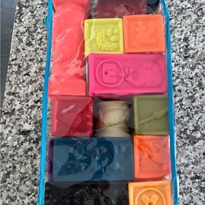 B. toys Elemenosqueeze Educational Baby Blocks